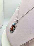 Very rare and collectable 19.62 ctw opal and diamond pendent