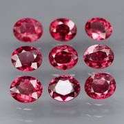 Lovely 6.08ct oval cut cherry red Rhodolite Garnet set