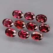 Lovely 9.09ct oval cut cherry red Rhodolite Garnet set