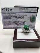 very nice dyed green beryl emerald ring. Over 13 ctw with round sapphire corundumset in silver