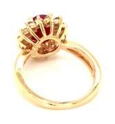 14kt Yellow gold oval lead treated ruby and diamond halo ring