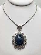 Very large 35.5ctw Star Blue Sapphire Cabochon with Natural Diamond Halo – Oval Cut Elegance pendent