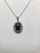 8.71ctw Star Blue Sapphire Cabochon with Natural Diamond Halo – Oval Cut Elegance pendent