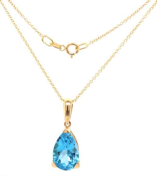 14kt Yellow gold pear shaped blue topaz pendant on chain