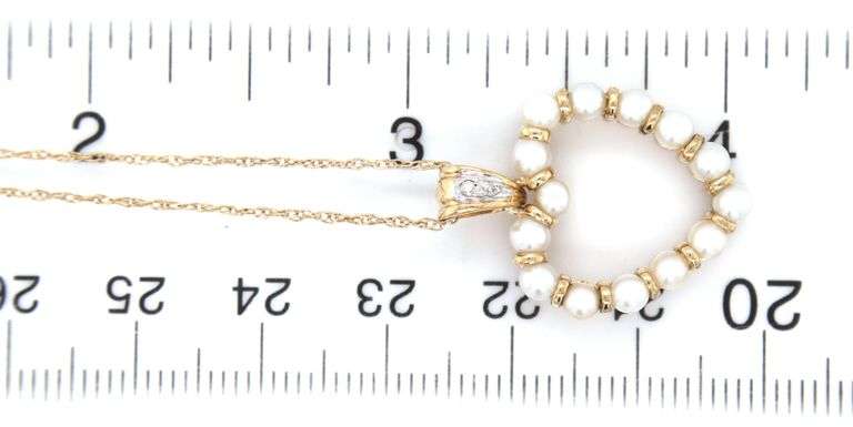 10kt Yellow gold 3mm pearl and diamond heart shaped pendant on chain