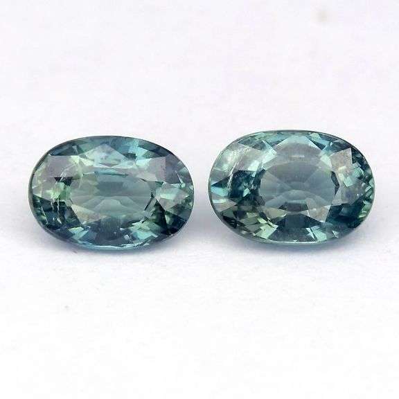 Glitter happens! 1.38ct UNTREATED blue green Sapphire set!