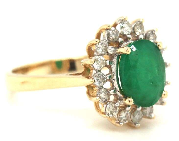 14kt Yellow gold oval emerald and diamond halo ring
