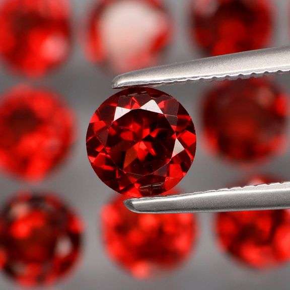 Outstanding 9.32ct diamond cut VS grade high fire Mozambique Garnet set