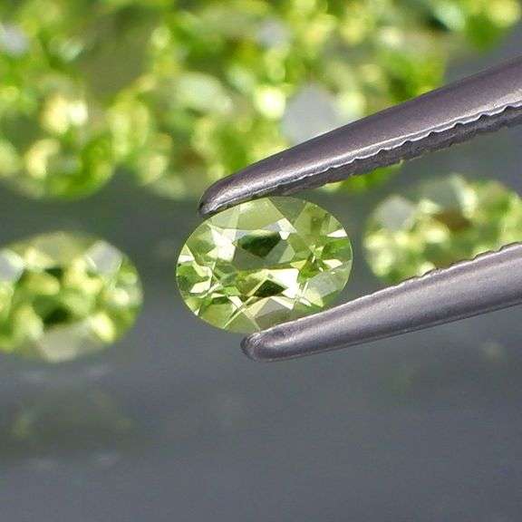Dazzling 7.13ct untreated apple green Peridot set