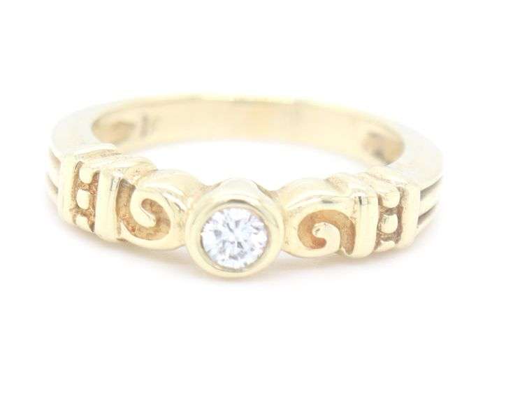18kt Yellow gold bezel set diamond ring