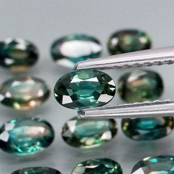 Heated only! 4.48ct blue green Sapphire set