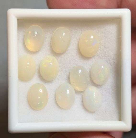 Glistening white! 8.08ct untreated Ethiopian Opal set!