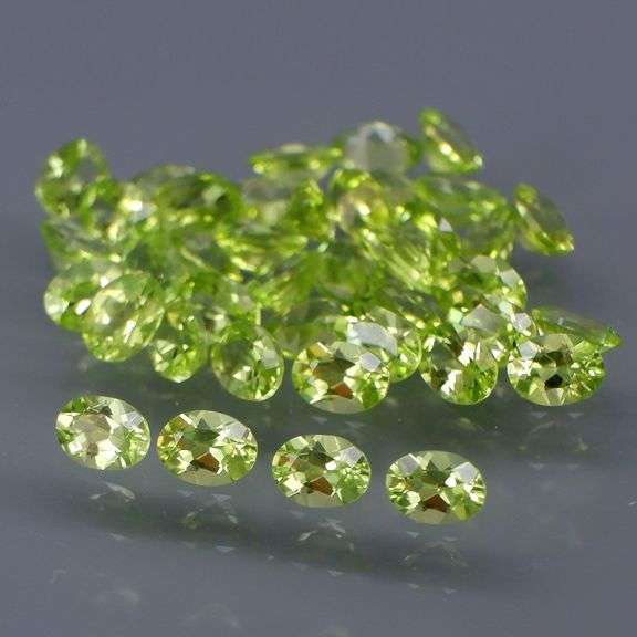 Dazzling 7.13ct untreated apple green Peridot set
