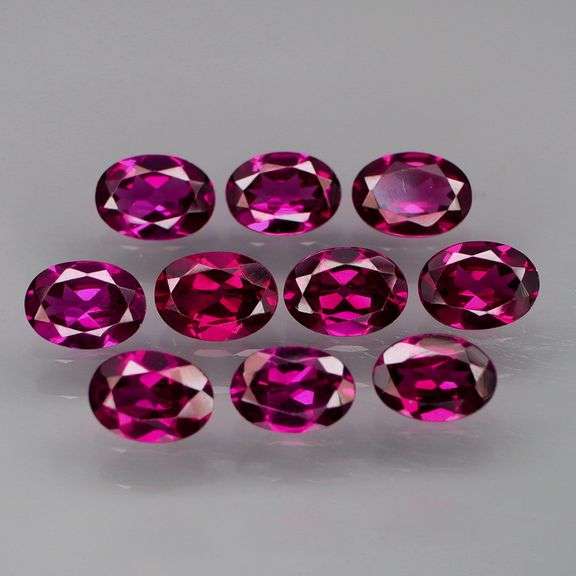 Amazing 9.38ct matched oval cut violet red Garnet set
