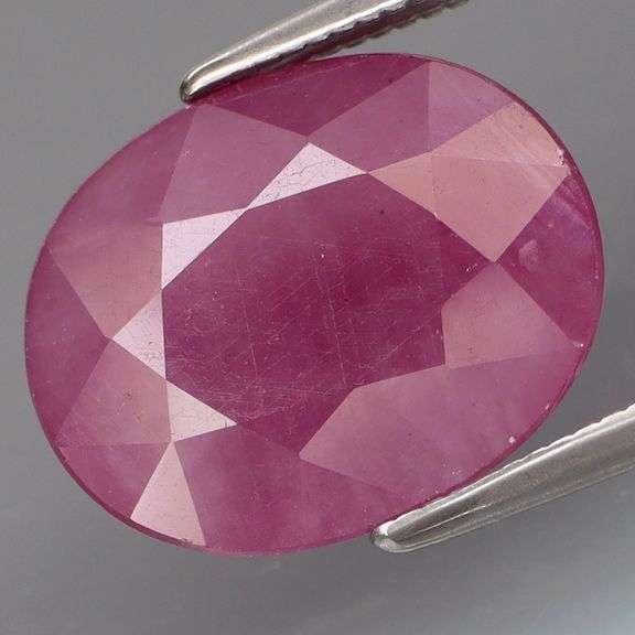 Heated only! 4.96ct rich reddish pink Ruby with a silver sheen from Mozambique!