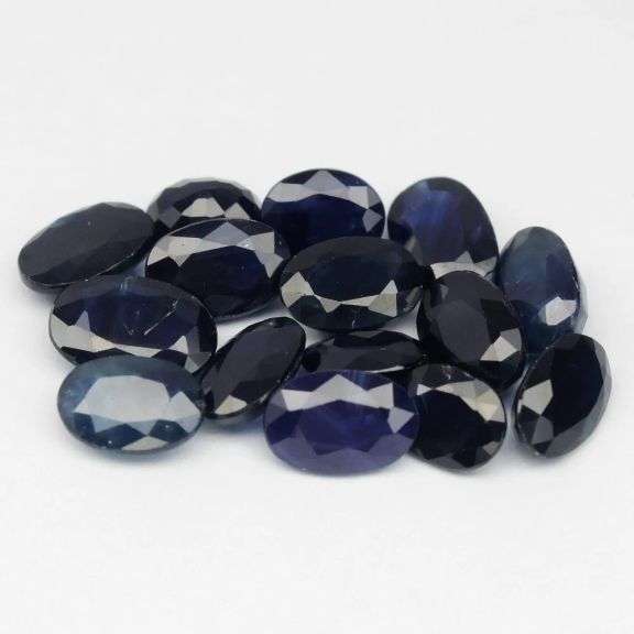 Absolutely stunning! 9.08ct ink blue Sapphire set!