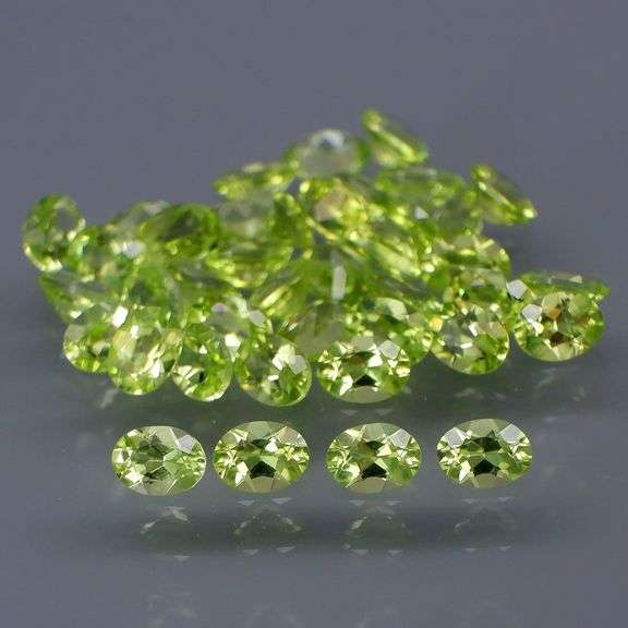 Dazzling 7.13ct untreated apple green Peridot set