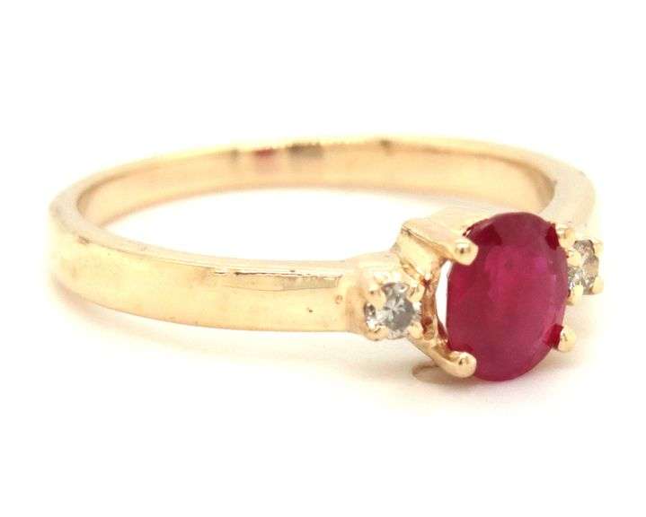 14kt Yellow gold ruby and diamond 3 stone ring