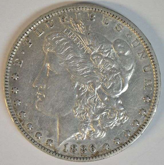 Choice original AU 1886-O Morgan Silver Dollar. Key date