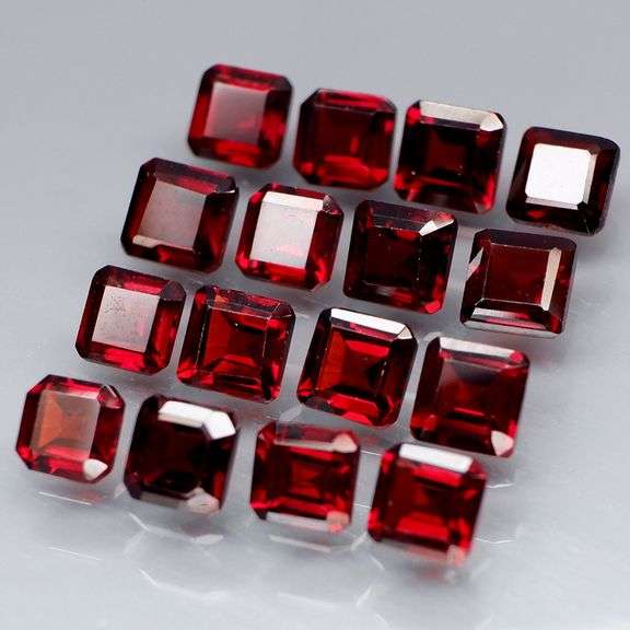 Stunning 7.36ct emerald cut cherry red Garnet set
