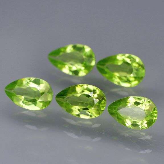 Dazzling 4.81ct untreated apple green Peridot set