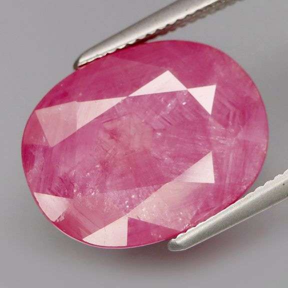 Heated only! 7.83ct rich reddish pink Ruby with a silver sheen from Mozambique!