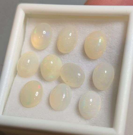 Glistening white! 8.08ct untreated Ethiopian Opal set!
