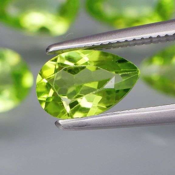 Dazzling 4.81ct untreated apple green Peridot set