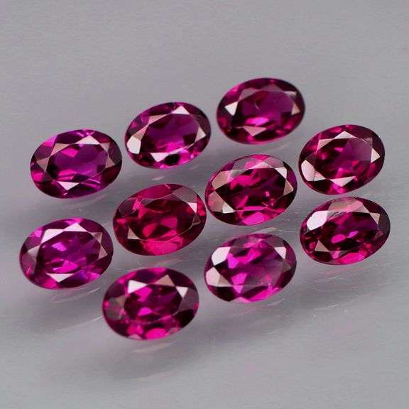 Amazing 9.38ct matched oval cut violet red Garnet set