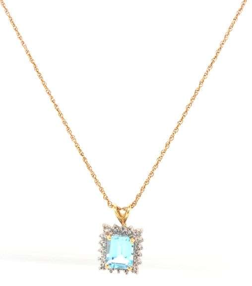 14kt Yellow gold 3ctw blue topaz and diamond accent pendant on chain