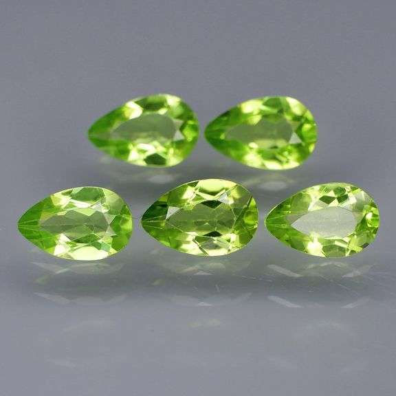 Dazzling 4.81ct untreated apple green Peridot set