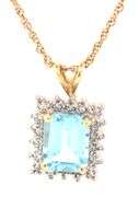 14kt Yellow gold 3ctw blue topaz and diamond accent pendant on chain