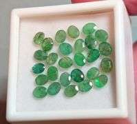Bright emerald green 6.29ct 27pc Emerald set