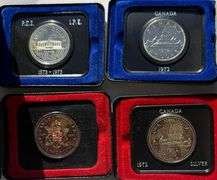 Two Silver Two Clad Canada Silver Dollars