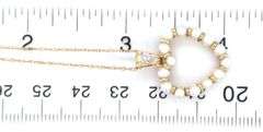 10kt Yellow gold 3mm pearl and diamond heart shaped pendant on chain