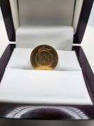 A 1/4 Azadi gold coin