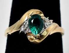 Beautiful 10K Yellow Gold Synthetic Emerald Gemstone Ring with Diamond Accents