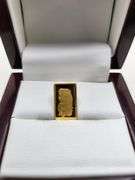 1 gram Suisse fine gold bar and 0.1 gram of gold paper coin