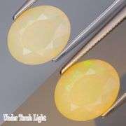 Smoldering flashing in this 1.72ct fully faceted Opal center stone