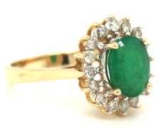 14kt Yellow gold oval emerald and diamond halo ring