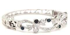 14kt White gold Retro 0.25ctw slightly included diamond and sapphire bangle bracelet