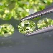 Dazzling 7.13ct untreated apple green Peridot set