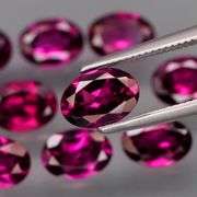 Amazing 9.38ct matched oval cut violet red Garnet set