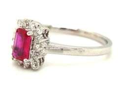 14kt White gold 0.70ct emerald cut ruby and diamond halo ring