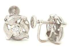 14kt White gold diamond textured flower clip on earrings
