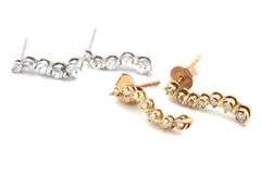 2 Pairs of 10kt diamond earrings