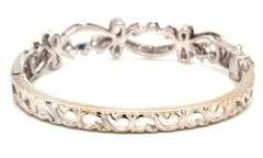 14kt White gold Retro 0.25ctw slightly included diamond and sapphire bangle bracelet
