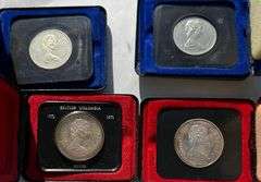 Two Silver Two Clad Canada Silver Dollars