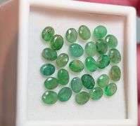 Bright emerald green 6.29ct 27pc Emerald set