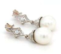 14kt White gold pearl and diamond accent drop earrings